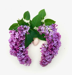 Lilac clusters form lungs around a yellow quartz heart